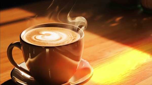 A warm drink on a table in soft light, suggesting a calm break